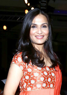 Soundarya Rajinikanth in an orange embroidered outfit at the NDTV Indian of the Year awards