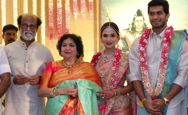 Soundarya Rajinikanth in bridal silk standing with her parents Rajinikanth and Latha Rajinikanth and Vishagan Vanangamudi