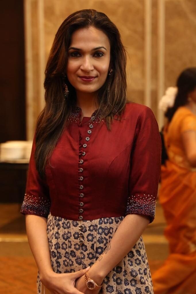 Soundarya Rajinikanth in a maroon and block-printed outfit at an industry gathering