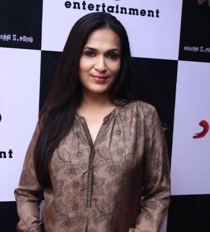 Soundarya Rajinikanth in a brown printed kurta at an entertainment company event